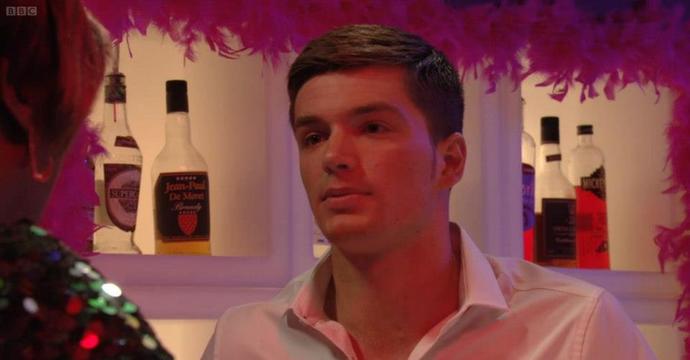 Why do guys often look attractive wearing a shirt with the collar open?