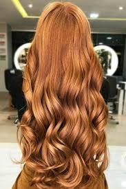 Want to grow out long copper hair that goes down to my butt, should I give my hair a trim again or just let it grow?