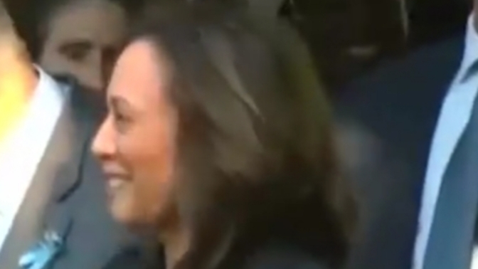 Why is Kamala Harris the only one smiling at the 9/11 memorial?