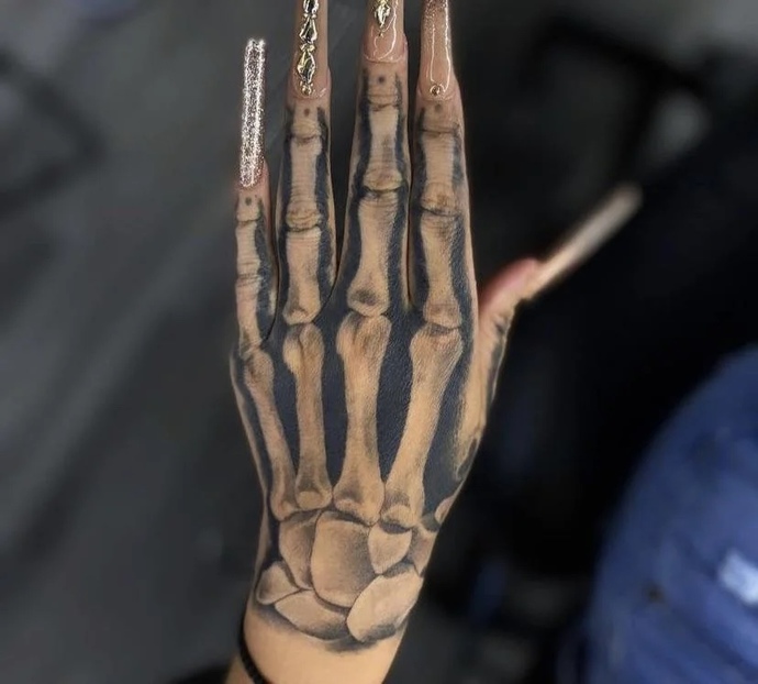 Do you find the skeleton hand tattoo attractive?