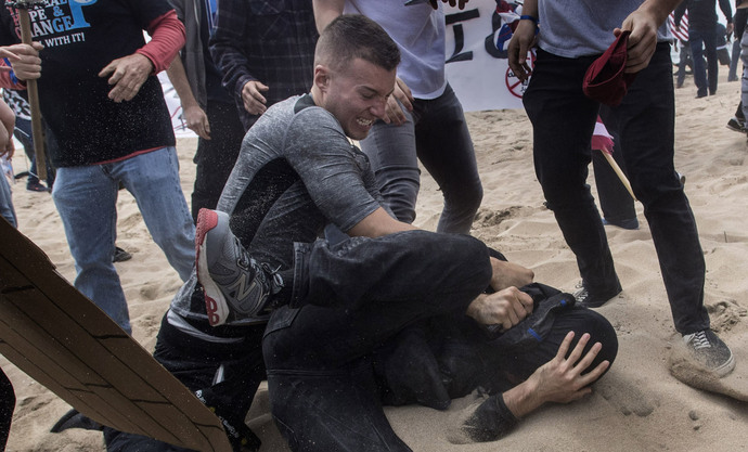 Robert Paul Rundo punches a counter-protester at a political rally at Bolsa Chica State Beach in Huntington Beach