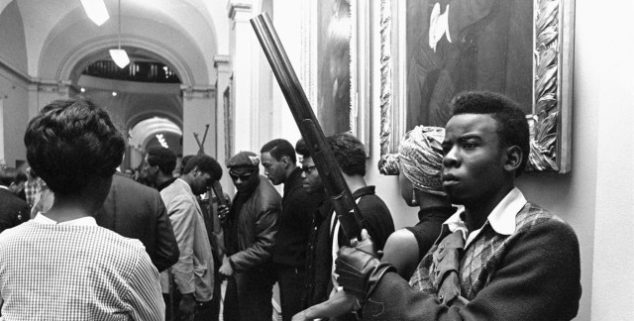 Does openly carrying a gun at a polling place constitute an act of intimidation?