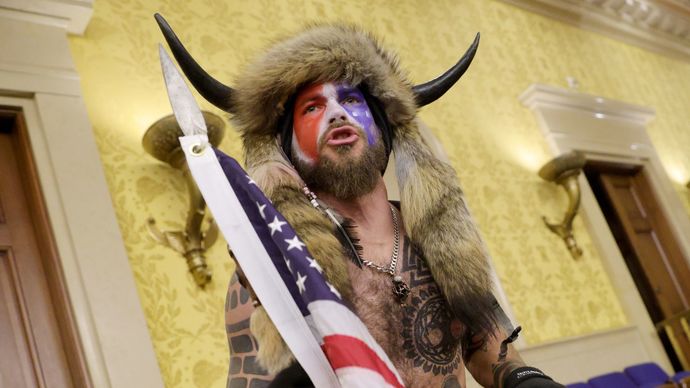 QAnon Shaman posting photo of himself in the Capitol on January 6