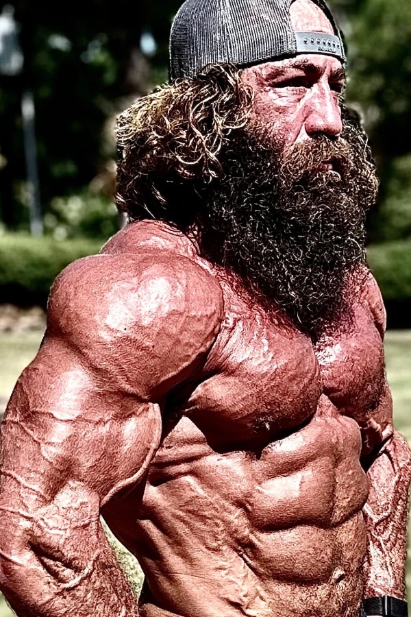 Why are men typically attracted to ultra-feminine women, while women don’t tend to be as attracted to ultra-masculine men?