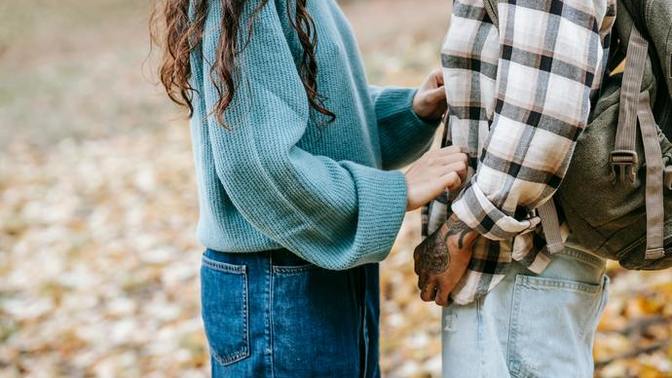 What does it mean if guy pinches my forearm and touch my hand?