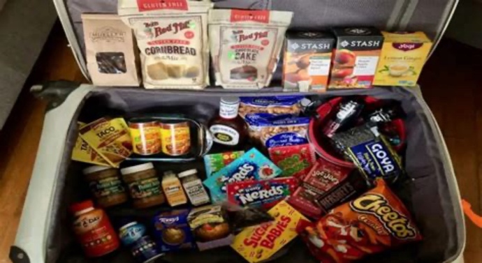 Why do immigrants pack loads of food when travelling?