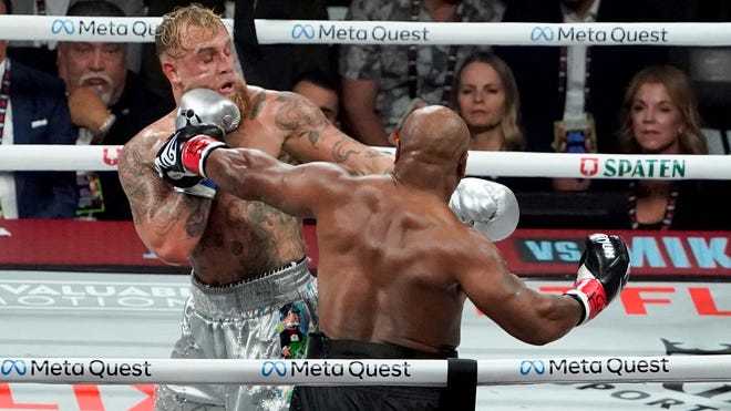 What are your thoughts on the boxing match between Mike Tyson and Jake Paul in Arlington, Texas? How did they do in their performance?