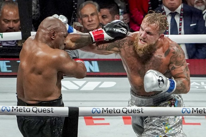 What are your thoughts on the boxing match between Mike Tyson and Jake Paul in Arlington, Texas? How did they do in their performance?