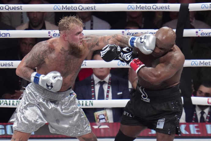 What are your thoughts on the boxing match between Mike Tyson and Jake Paul in Arlington, Texas? How did they do in their performance?