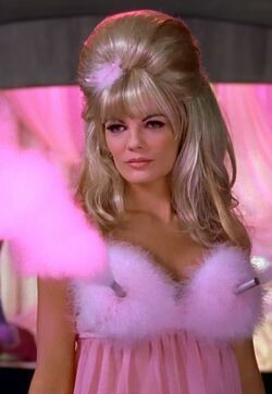 Why does a guy gay keep glancing at my chest and getting nervous whilst I did his eyebrows?