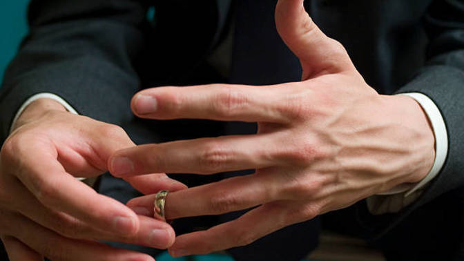 My boss takes off his wedding ring whenever he talks to me during our monthly one-on-ones, should I be concerned?