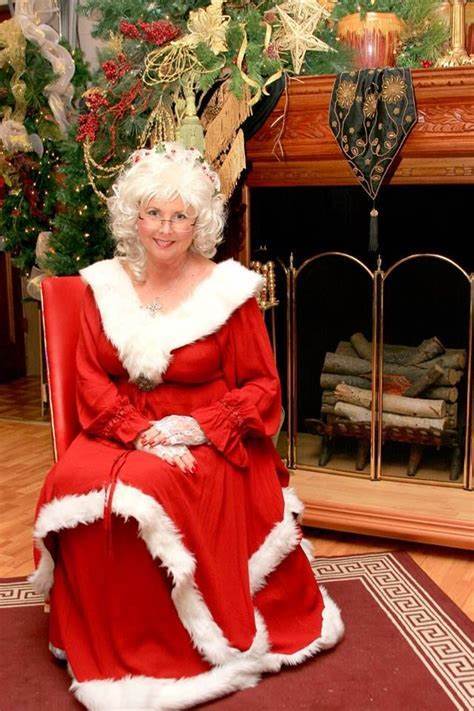 What does MRS CLAUS do while SANTA is AWAY delivering presents?