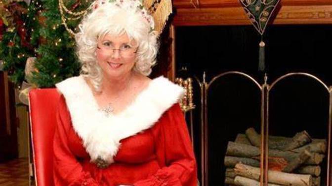 What does MRS CLAUS do while SANTA is AWAY delivering presents?