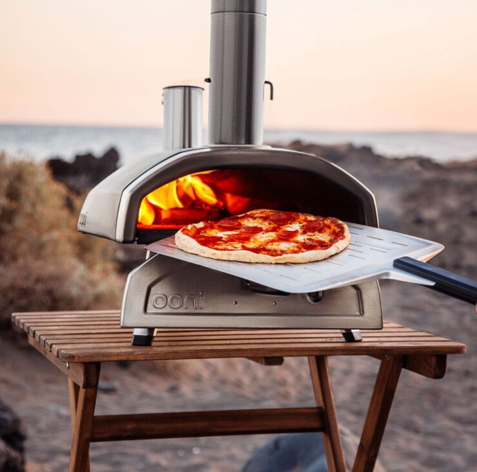 Who can cook good pizza at home and loves doing it?