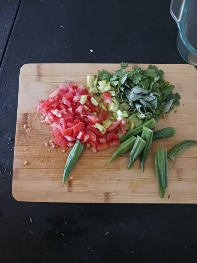 Ground beef with Okra, lemon juice, salt, diced tomatoes, diced peppers, cilantro, and poultry greens?
