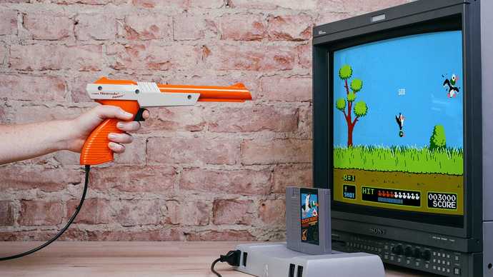 You hear a knock on the door and when you check it out you see a dude dressed all in black pointing an NES Zapper at you. what do you do?