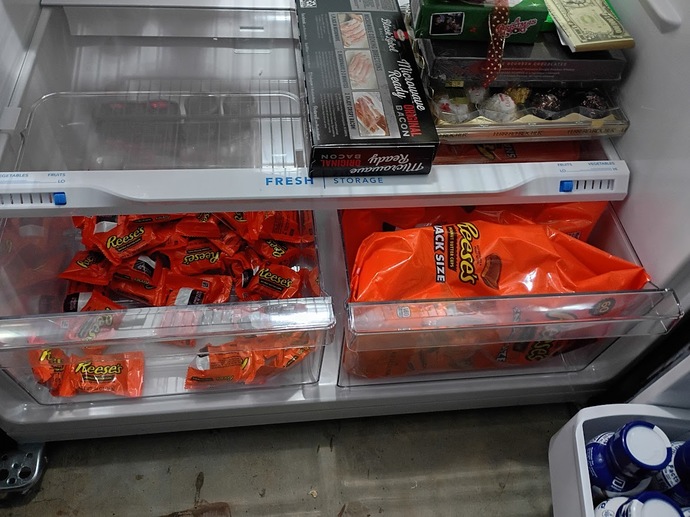 These two refrigerator drawers are never empty with Reese's. 
