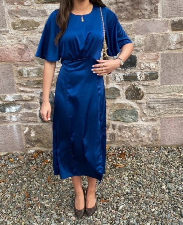 Is this an OK wedding guest dress, or does it look like a bridesmaids dress?