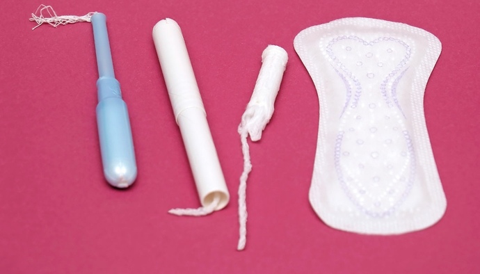 What is the total annual cost of feminine hygiene products?
