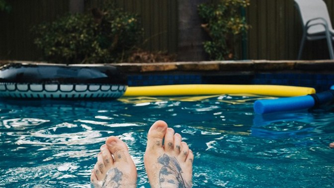 If a guy sends a pic of his legs by the pool is it flirty or just friendly?