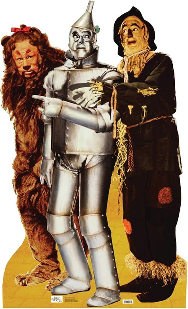 Which famous people are the equivalent of the scarecrow (heartless), tin man (brainless), and lion (cowardly) from The Wizard of Oz?