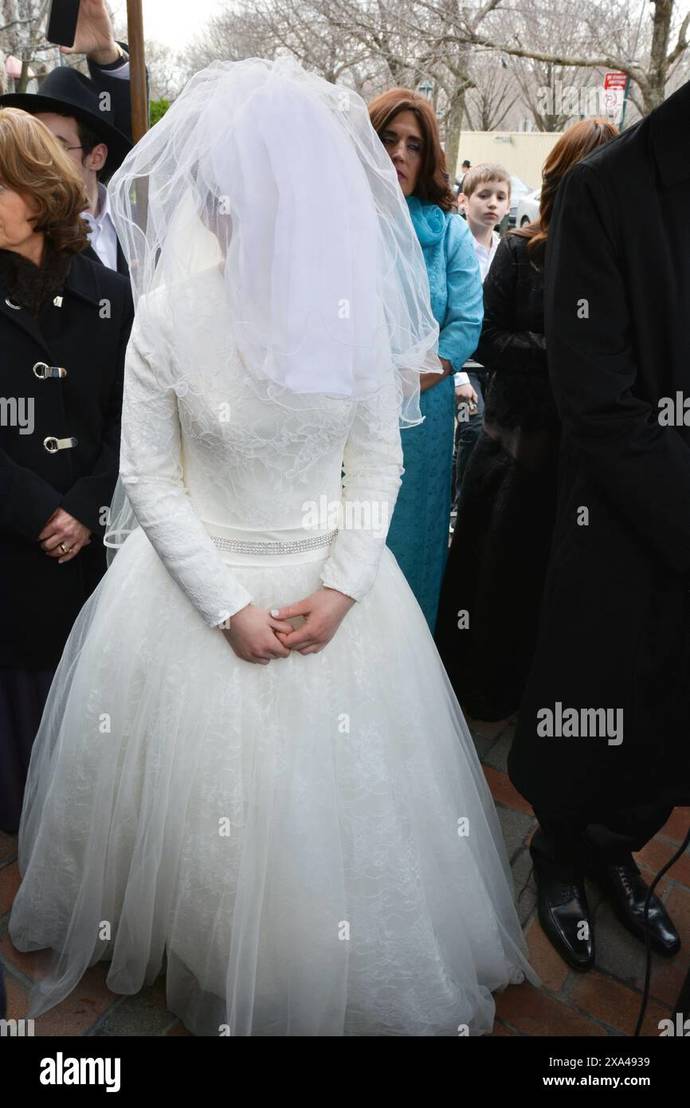 Girls, should brides try to look as hot as possible in their wedding dress? Or would that be considered trashy?