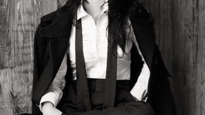 A Woman Dressed In A Smoking. Thoughts?