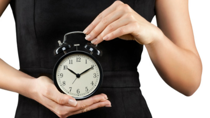 Why is a woman's biological clock seen as a disadvantage?