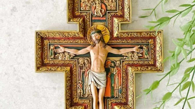 Why do some atheists display a crucifix or images of Jesus in their house?