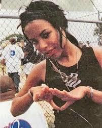 Throwing up the Diamond + Roc-A-Fella tank (Hov the best rapper of all time by the way).