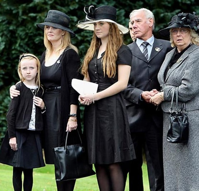 Real people at a real funeral for a real war hero