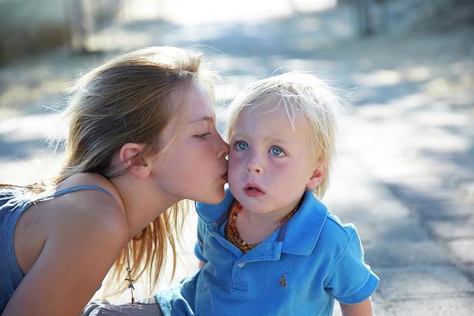 Why would a girl kiss a guy multiple times on the cheek?