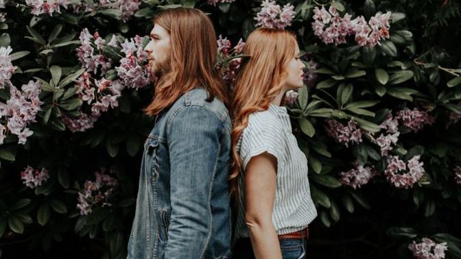 Why are individuals sometimes drawn to partners with opposing traits or personalities?