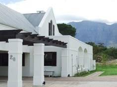 If you could build the house of your dreams where would it be and what would it be or look like?
