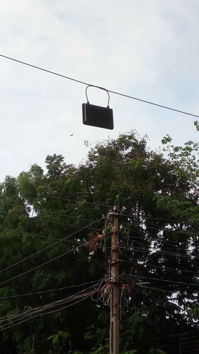 Why are there girls purses hanging on some electrical wires of the road?