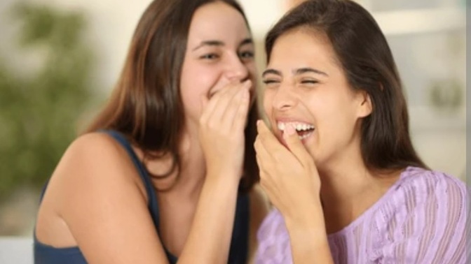 If a guy approaches a girl and she starts giggling with her friends, does that mean they’re mocking him or find him unattractive?