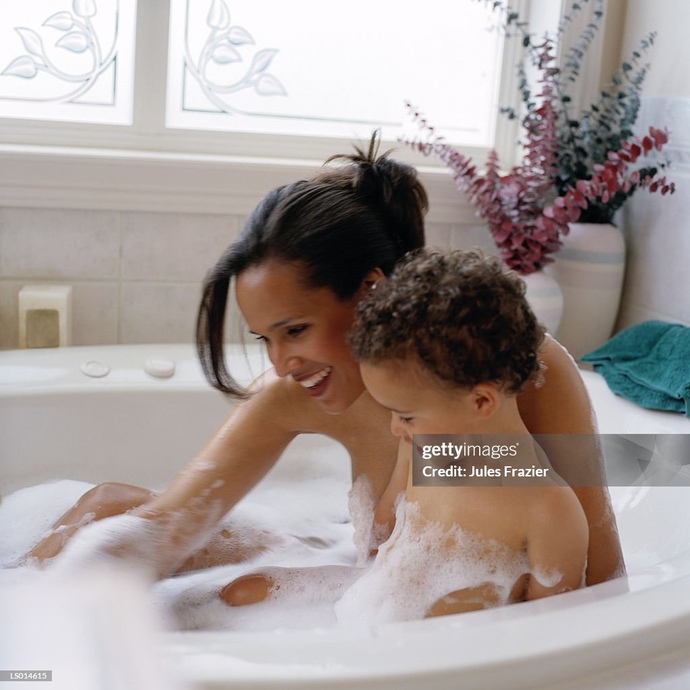 Is it normal for my girlfriend to shower with my neighbours 4 year old son?