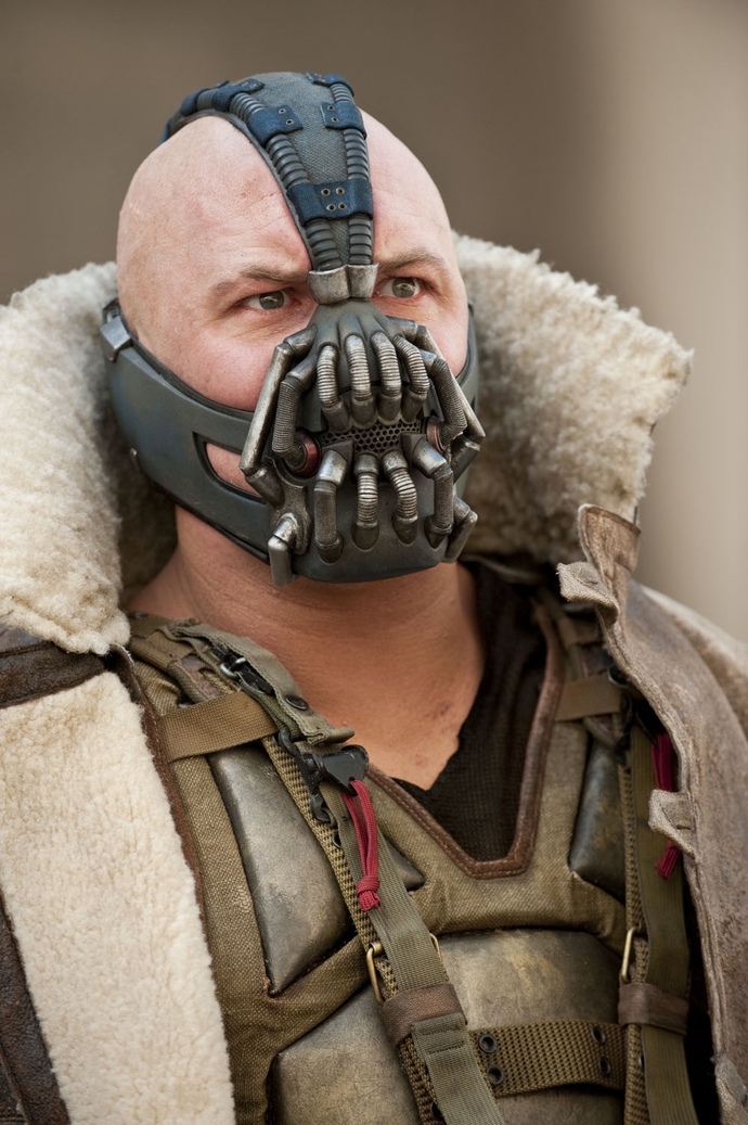 Why did they make Bane so intelligent in Dark Knight Rises when he was dumb as a stump in the animated series and Arkham Asylum?