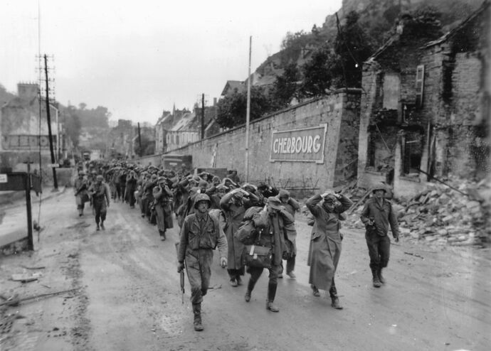 US anti-fascist soldiers leading away POW fascist scum in Cherbourg, 1944.