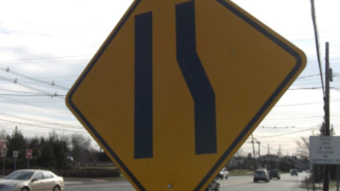Why do some roads have two lanes that suddenly merge into one?