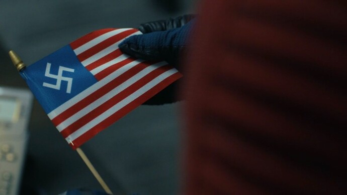AMERICA, WHY DO YOU HAVE A REPUBLICAN REPRESENTATIVE WITH A SWASTI*A AMERICA FLAG?