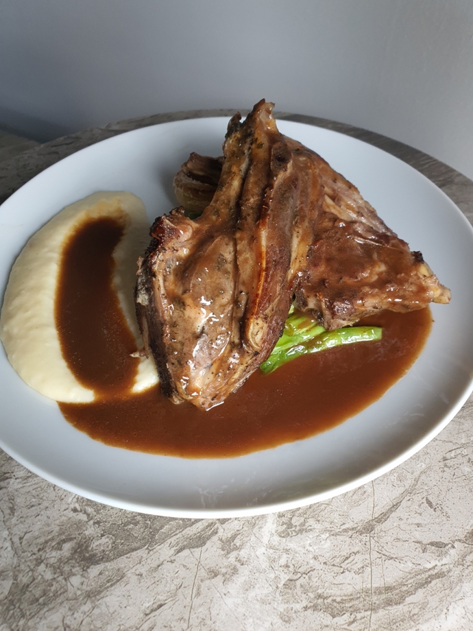Lamb Ribs with a Pomme Puree, Grilled Onions and Butter Poached Long Beans. Served with a simple Pepper and Mushroom Sauce.