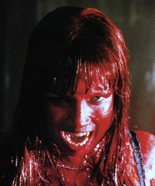 What does it mean when a woman looks at me, licks her front teeth, and smiles?