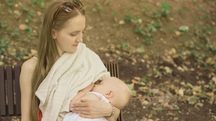 Even if using a blanket to cover as much as she can., would half the adults in the USA be offended if a young mother nurses her infant in public?