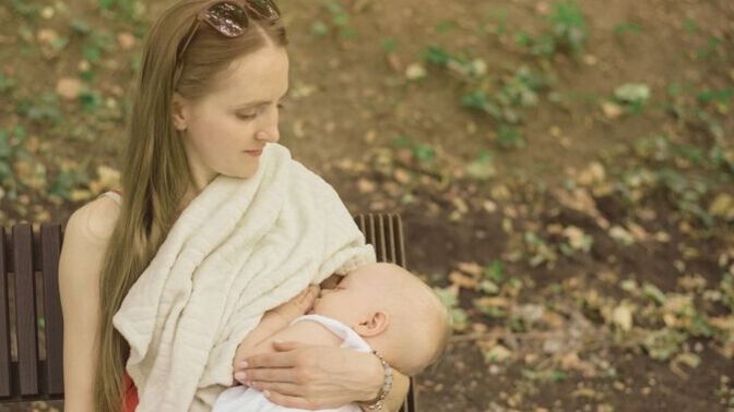Even if using a blanket to cover as much as she can., would half the adults in the USA be offended if a young mother nurses her infant in public?