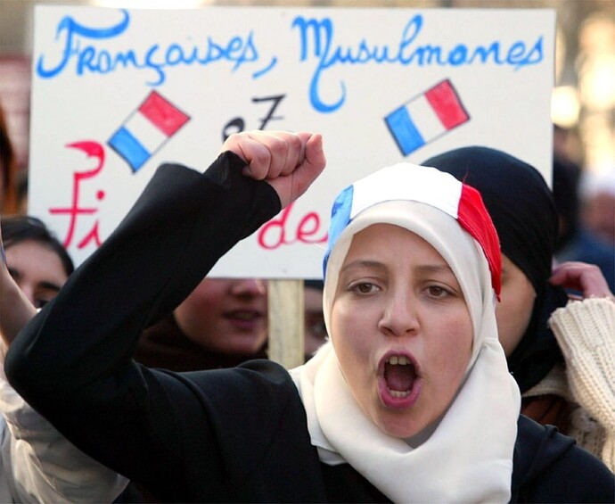 Why does France ban religious symbols in schools?