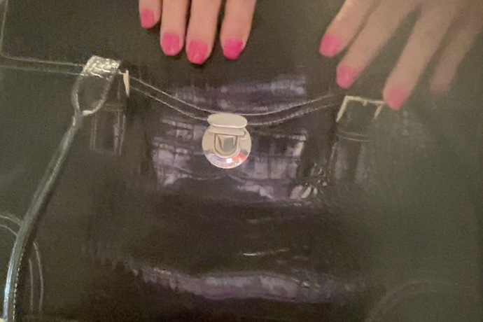 Should I carry a black or brown bag with casual outfits including jeans in the winter?