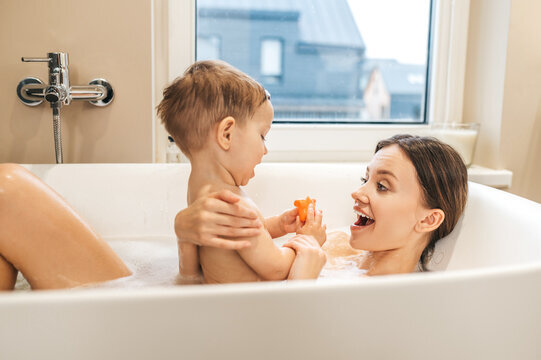 At what age should children stop taking a bath with another family member?