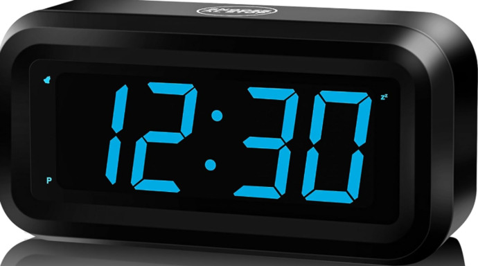 What color is the sky when the clock reads 12:30?