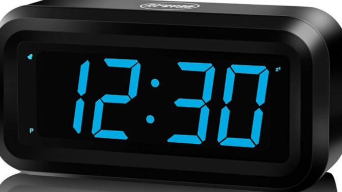 What color is the sky when the clock reads 12:30?
